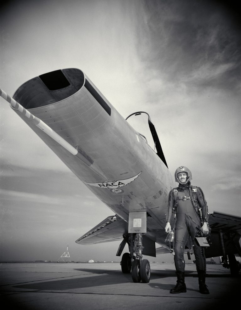 NACA Test Pilot Poses with Plane